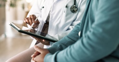 Physician with clipboard treating patient. Can I open a clinic without being a doctor